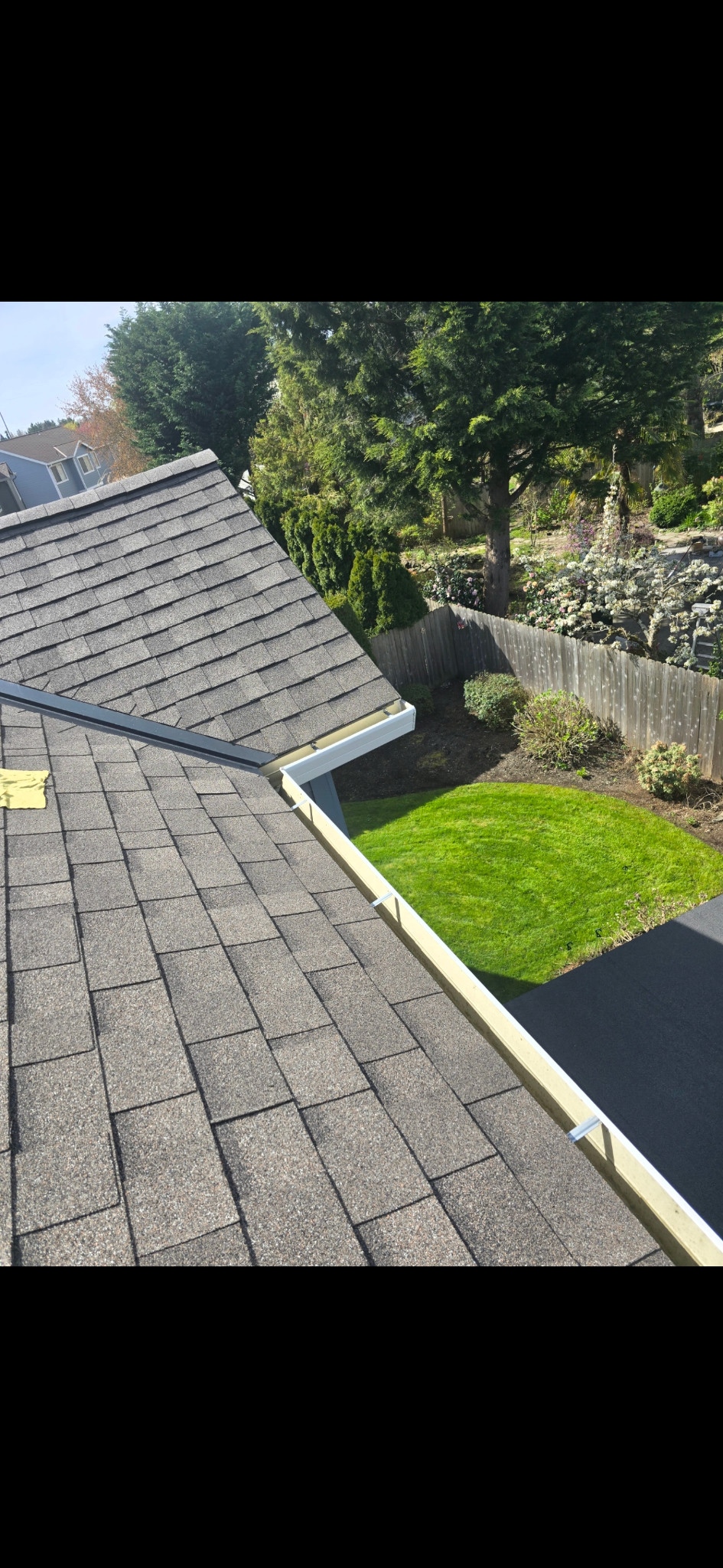 Same gutter corner with a visibly cleaner outside face, from a different angle.